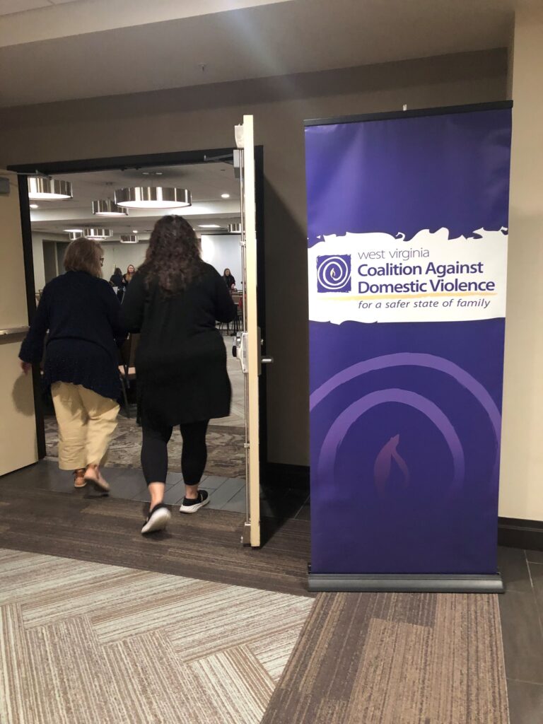 People walking in to a WVCADV training
