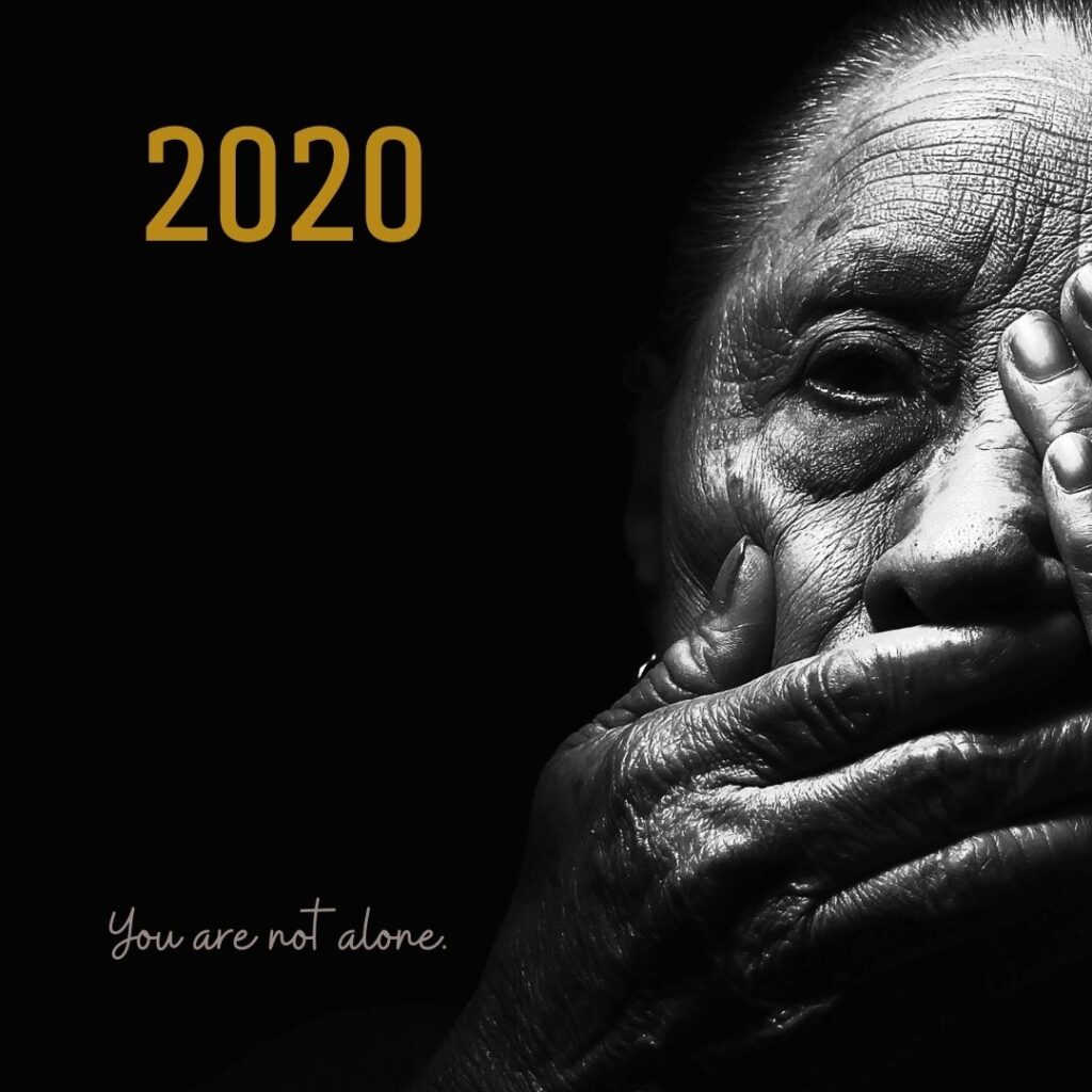 The year "2020" superimposed over a photo of a much-lined face with hands covering most of it, including the mouth and an eye