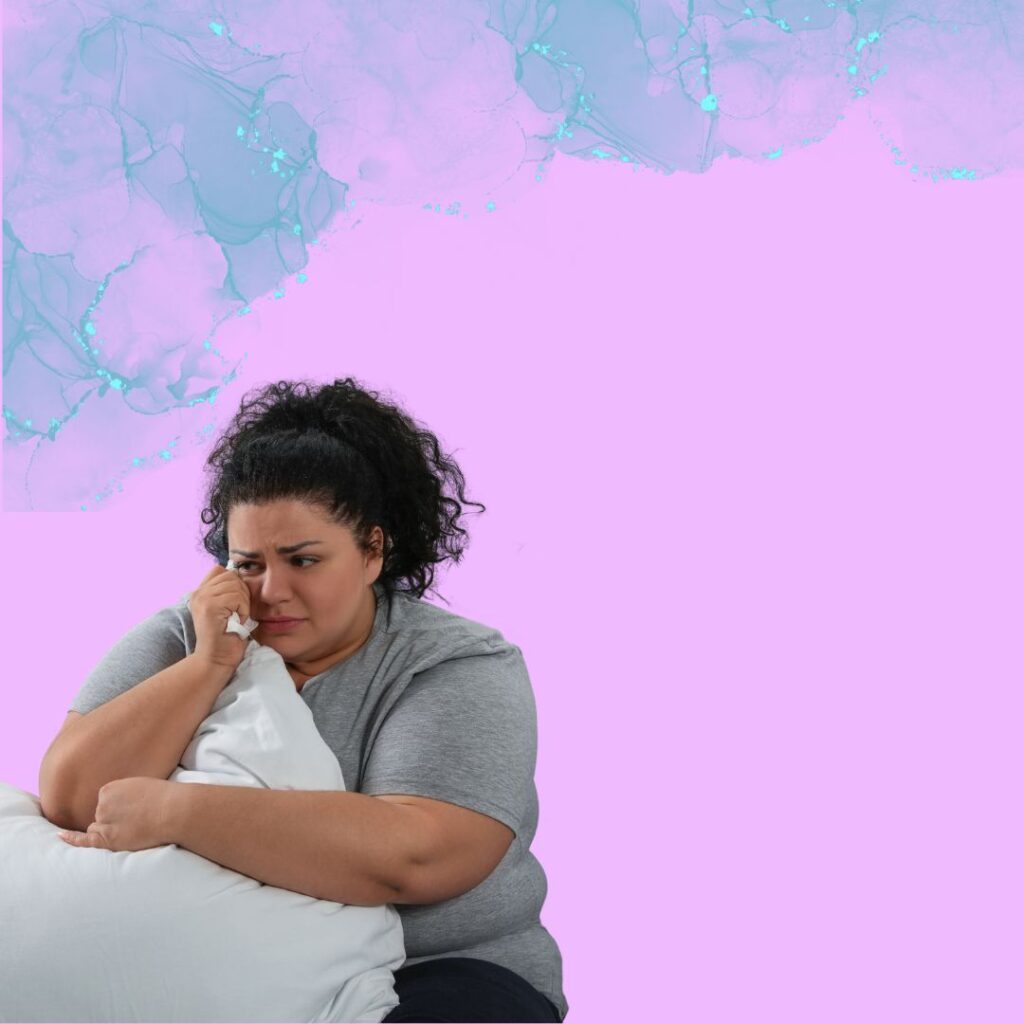 Background graphic of a crying woman hugging a pillow to herself, as if in comfort