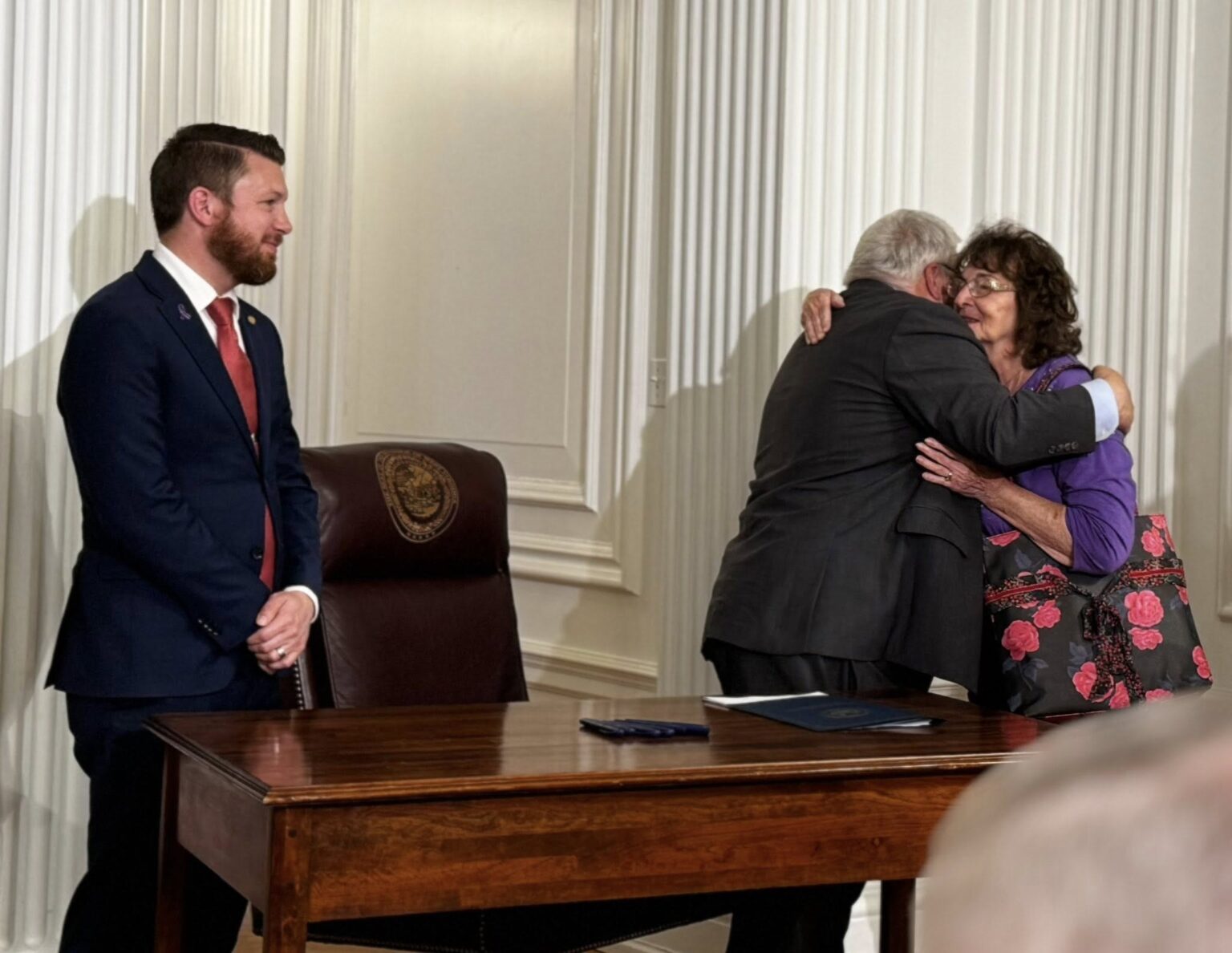 Governor Morrissey embraces the mother of Joanna Phillips